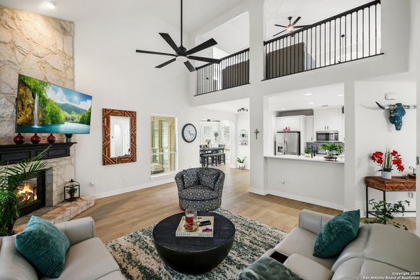 Fireplace, Interior, Kitchen, Living room, Recessed Lighting, Stone Walls, Wood Texture Flooring
