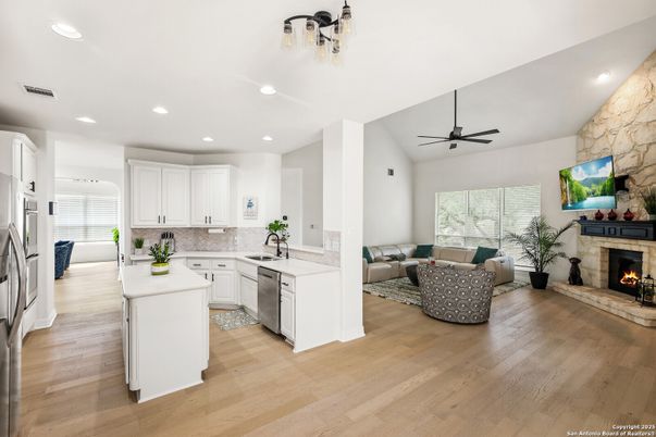 Fireplace, Interior, Kitchen, Living room, Recessed Lighting, Stone Walls, Wood Texture Flooring