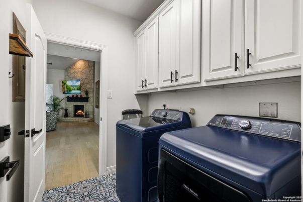 Fireplace, Interior, Stone Walls, Washer, Wood Texture Flooring