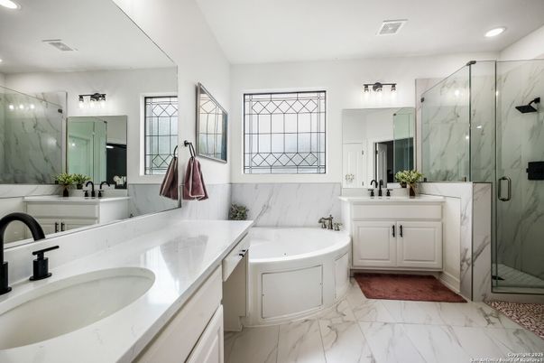 Bathroom, Dual Sink Vanities, Glass Shower, Interior, Marble, Marble Walls, Recessed Lighting
