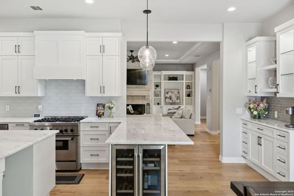 Fireplace, Interior, Kitchen, Pendant Lights, Recessed Lighting, Stainless Steel Appliances, Wood Texture Flooring