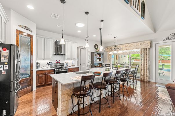 Dining room, Interior, Kitchen, Pendant Lights, Recessed Lighting, Stainless Steel Appliances, Wood Texture Flooring