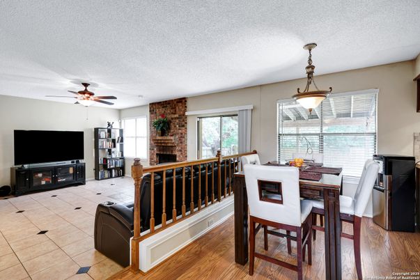 Dining room, Fireplace, Interior, Pendant Lights, Stone Walls, Wood Texture Flooring