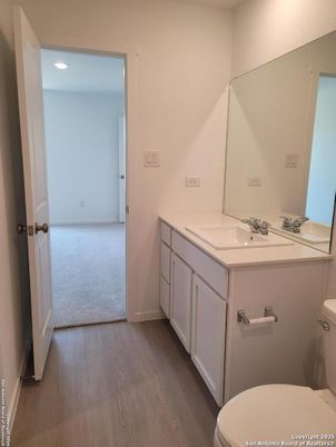 Bathroom, Dual Sink Vanities, Interior, Recessed Lighting, Wood Texture Flooring