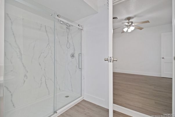 Bathroom, Glass Shower, Interior, Marble Walls, Wood Texture Flooring