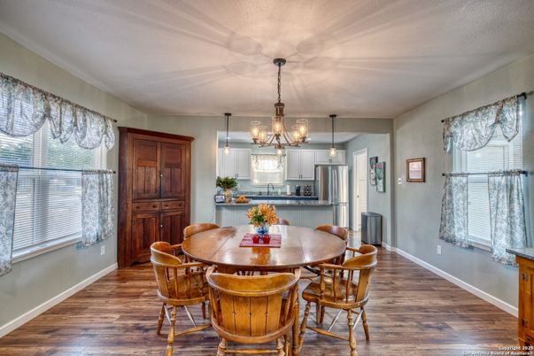 Chandelier, Dining room, Interior, Kitchen, Pendant Lights, Stainless Steel Appliances, Wood Texture Flooring