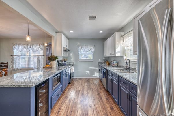 Interior, Kitchen, Pendant Lights, Recessed Lighting, Stainless Steel Appliances, Wood Texture Flooring