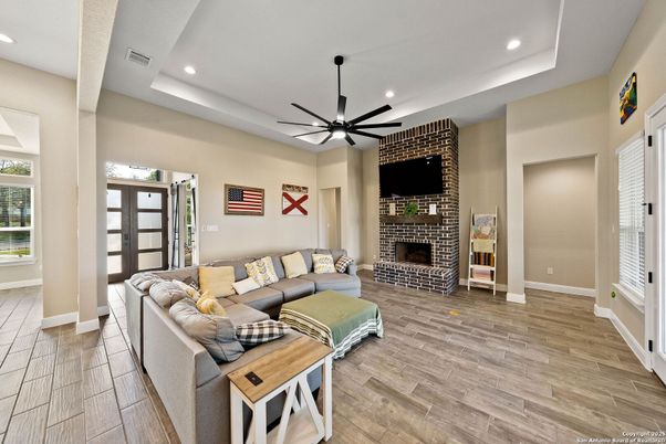 Fireplace, Interior, Living room, Recessed Lighting, Stone Walls, Wood Texture Flooring