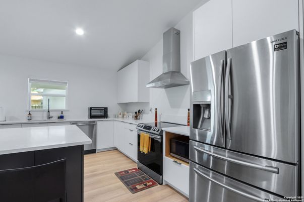 Interior, Kitchen, Recessed Lighting, Stainless Steel Appliances, Wood Texture Flooring
