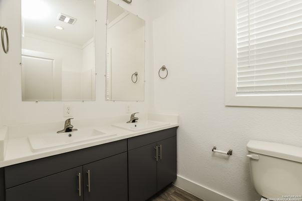Bathroom, Dual Sink Vanities, Interior, Recessed Lighting, Wood Texture Flooring