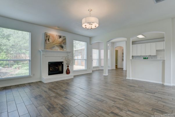 Chandelier, Empty room, Fireplace, Interior, Recessed Lighting, Wood Texture Flooring