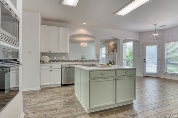 Chandelier, Interior, Kitchen, Pendant Lights, Recessed Lighting, Stainless Steel Appliances, Wood Texture Flooring