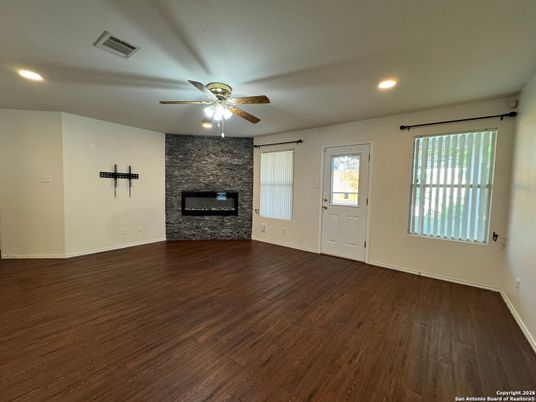 Empty room, Fireplace, Interior, Recessed Lighting, Stone Walls, Wood Texture Flooring