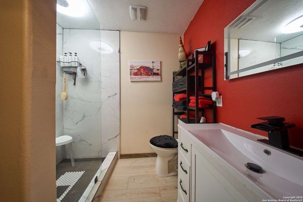 Bathroom, Glass Shower, Interior, Marble Walls, Wood Texture Flooring