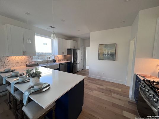 Dining room, Interior, Kitchen, Pendant Lights, Recessed Lighting, Stainless Steel Appliances, Wood Texture Flooring