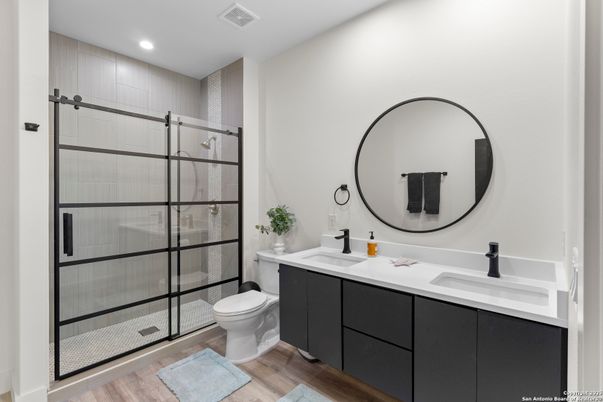 Bathroom, Dual Sink Vanities, Glass Shower, Interior, Recessed Lighting, Wood Texture Flooring