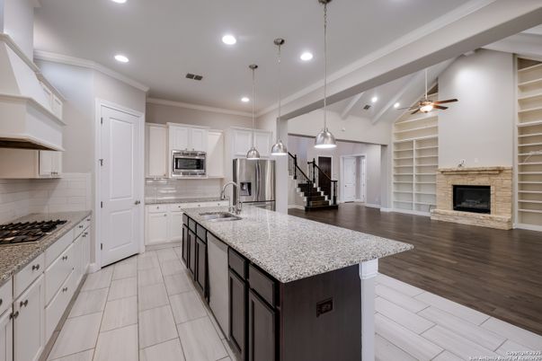 Fireplace, Interior, Kitchen, Pendant Lights, Recessed Lighting, Stainless Steel Appliances, Wood Texture Flooring