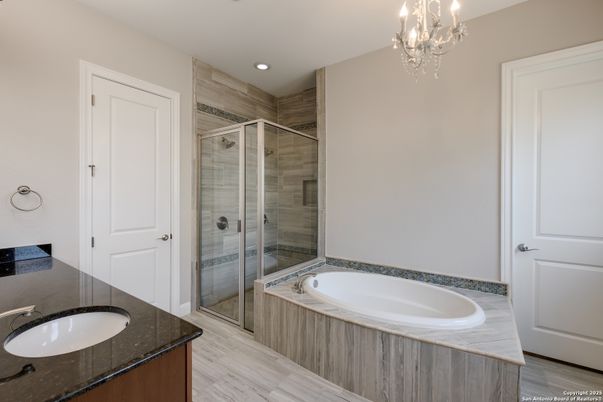 Bathroom, Chandelier, Dual Sink Vanities, Glass Shower, Interior, Recessed Lighting, Wood Texture Flooring