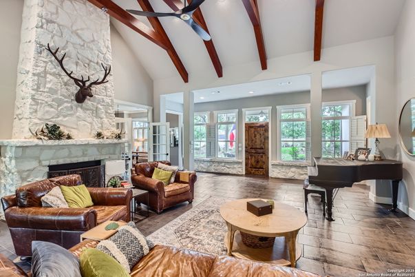 Fireplace, Interior, Living room, Piano, Recessed Lighting, Stone Walls, Wooden Beams, Wood Texture Flooring