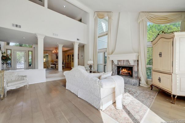 Chandelier, Dining room, Fireplace, Interior, Living room, Recessed Lighting, Wood Texture Flooring