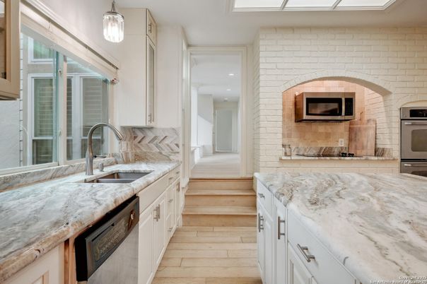 Interior, Kitchen, Pendant Lights, Recessed Lighting, Stainless Steel Appliances, Stone Walls, Wood Texture Flooring
