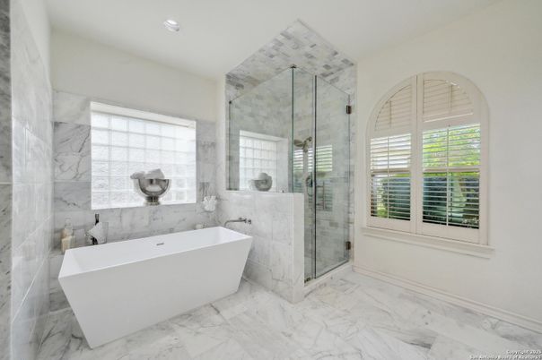 Bathroom, Free Standing Baths, Glass Shower, Interior, Marble, Marble Walls, Recessed Lighting