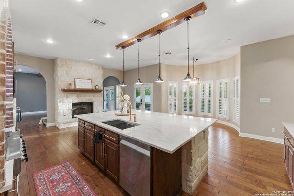 Fireplace, Interior, Kitchen, Pendant Lights, Recessed Lighting, Stone Walls, Wood Texture Flooring