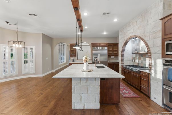 Interior, Kitchen, Pendant Lights, Recessed Lighting, Stainless Steel Appliances, Stone Walls, Wood Texture Flooring