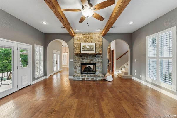 Empty room, Fireplace, Interior, Recessed Lighting, Stone Walls, Wooden Beams, Wood Texture Flooring