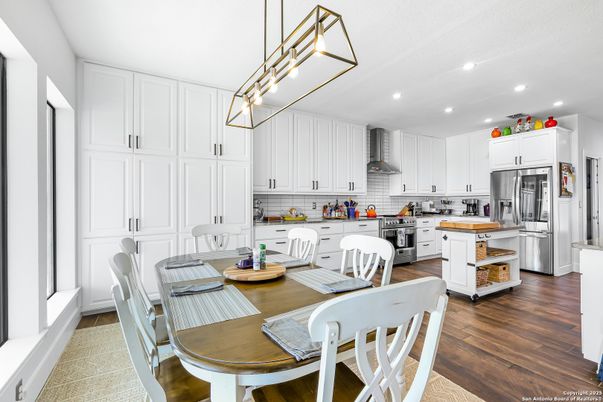 Dining room, Interior, Kitchen, Pendant Lights, Recessed Lighting, Stainless Steel Appliances, Wood Texture Flooring