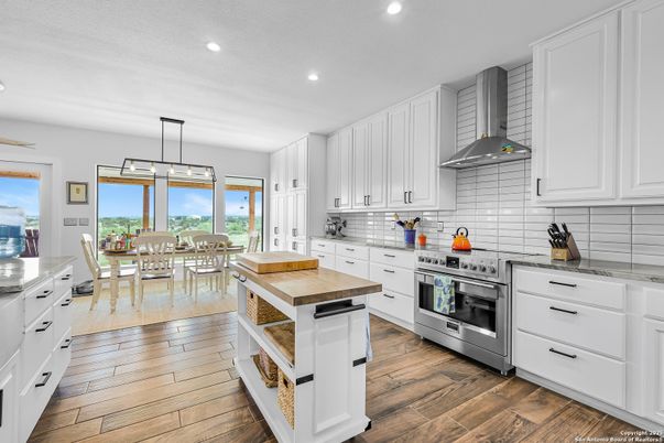 Dining room, Interior, Kitchen, Pendant Lights, Recessed Lighting, Stainless Steel Appliances, Wood Texture Flooring