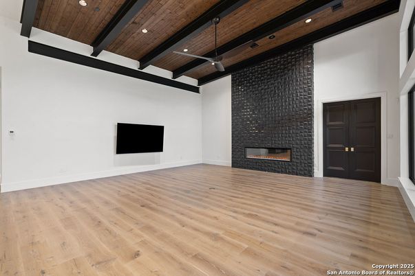 Empty room, Fireplace, Interior, Recessed Lighting, Wooden Beams, Wooden Ceilings, Wood Texture Flooring