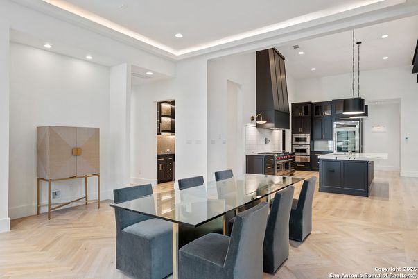 Dining room, Interior, Kitchen, Pendant Lights, Recessed Lighting, Stainless Steel Appliances, Wood Texture Flooring