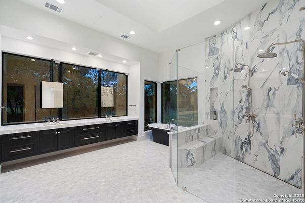 Bathroom, Dual Sink Vanities, Free Standing Baths, Glass Shower, Interior, Marble Walls, Recessed Lighting