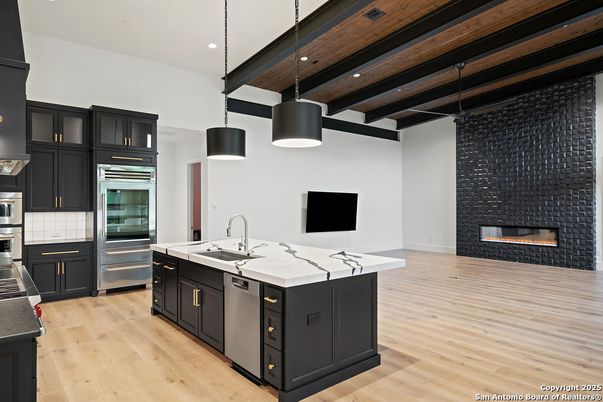 Fireplace, Interior, Kitchen, Pendant Lights, Recessed Lighting, Stainless Steel Appliances, Wooden Beams, Wooden Ceilings, Wood Texture Flooring