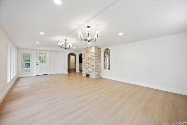Chandelier, Empty room, Fireplace, Interior, Recessed Lighting, Wood Texture Flooring