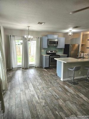 Chandelier, Interior, Kitchen, Stainless Steel Appliances, Wood Texture Flooring