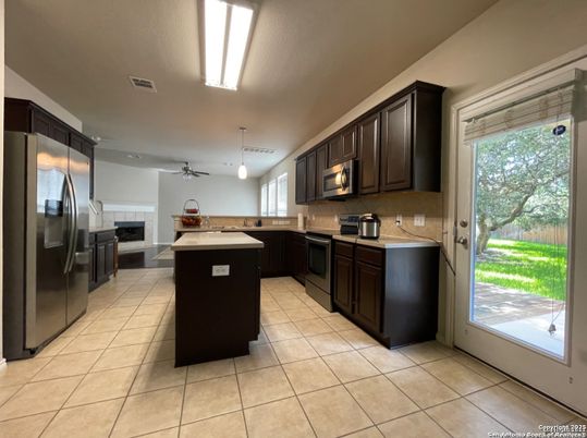 Fireplace, Interior, Kitchen, Pendant Lights, Recessed Lighting, Stainless Steel Appliances