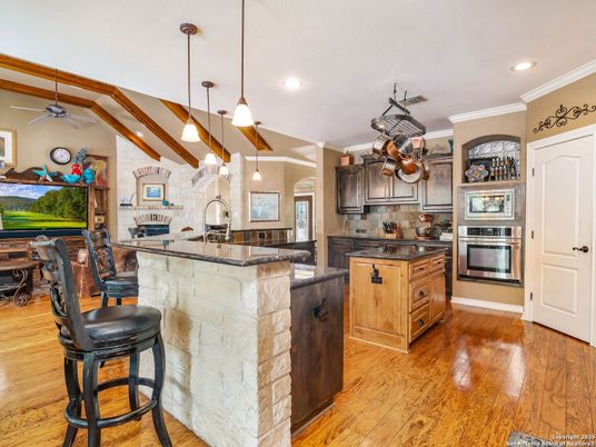 Interior, Kitchen, Pendant Lights, Recessed Lighting, Stainless Steel Appliances, Stone Walls, Wooden Beams, Wood Texture Flooring