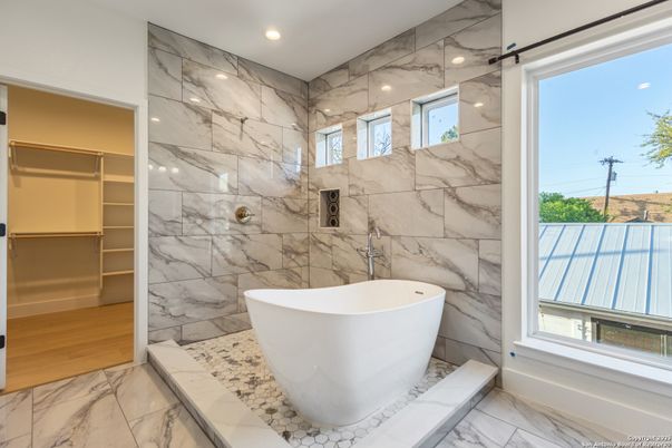 Bathroom, Free Standing Baths, Interior, Marble, Marble Walls, Recessed Lighting, Wood Texture Flooring