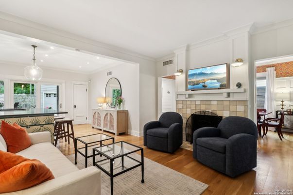 Dining room, Fireplace, Interior, Living room, Pendant Lights, Recessed Lighting, Wood Texture Flooring