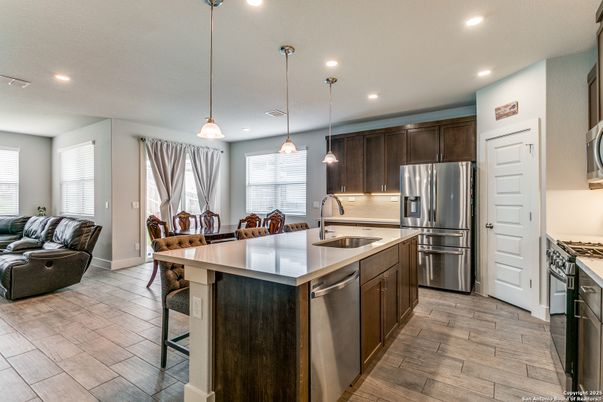 Dining room, Interior, Kitchen, Pendant Lights, Recessed Lighting, Stainless Steel Appliances, Wood Texture Flooring