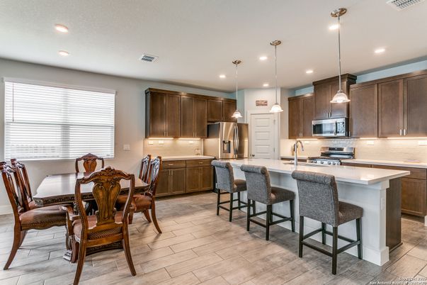 Dining room, Interior, Kitchen, Pendant Lights, Recessed Lighting, Stainless Steel Appliances, Wood Texture Flooring