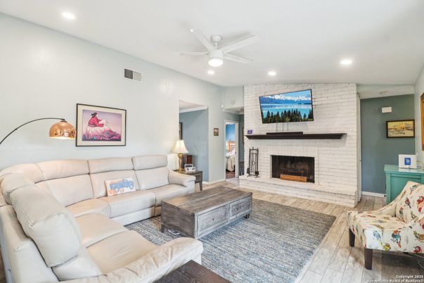 Fireplace, Interior, Living room, Recessed Lighting, Stone Walls, Wood Texture Flooring