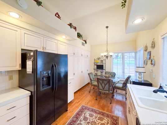 Chandelier, Dining room, Interior, Kitchen, Recessed Lighting, Tile Countertops, Wood Texture Flooring