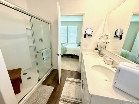 Bathroom, Bedroom, Dual Sink Vanities, Glass Shower, Interior, Wood Texture Flooring