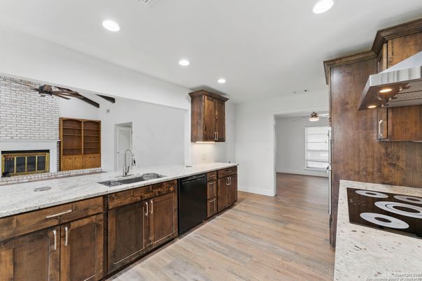Fireplace, Interior, Kitchen, Recessed Lighting, Wood Texture Flooring