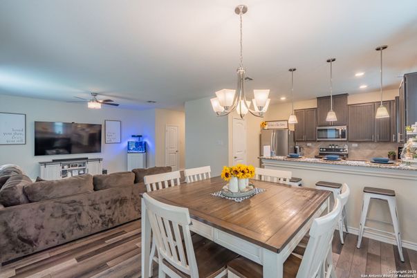 Chandelier, Dining room, Interior, Kitchen, Living room, Pendant Lights, Recessed Lighting, Stainless Steel Appliances, Wood Texture Flooring