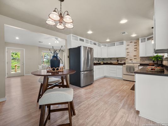 Dining room, Interior, Kitchen, Recessed Lighting, Stainless Steel Appliances, Wood Texture Flooring