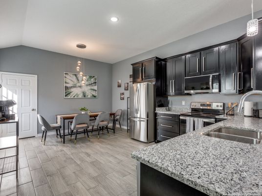 Dining room, Interior, Kitchen, Pendant Lights, Recessed Lighting, Stainless Steel Appliances, Wood Texture Flooring